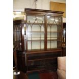 A 19th Century library bookcase with Gothic glazed upper section over open shelves below.140cm