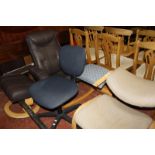 A modern leather reclining chair and stool, two orthopaedic desk chairs and a swivel office chair.