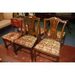 Four Georgian style dining chairs and a pair leather covered hall chairs on bobbin supports.