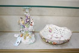 A Continental porcelain centrepiece, the pierced and flower encrusted bowl on figural stem with gilt