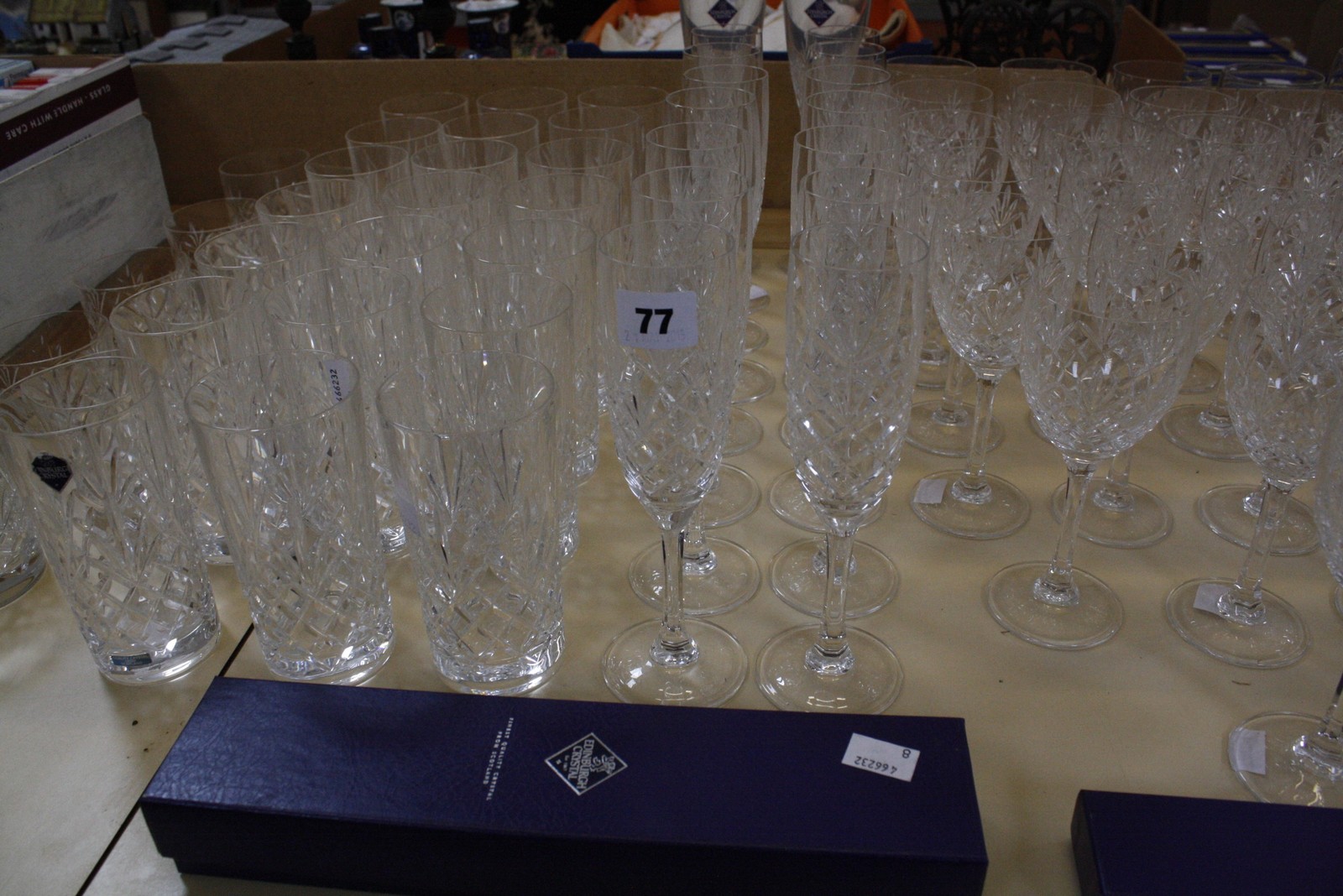 An Edinburgh Crystal glass part service, with two matched champagne flutes, some of the champagne