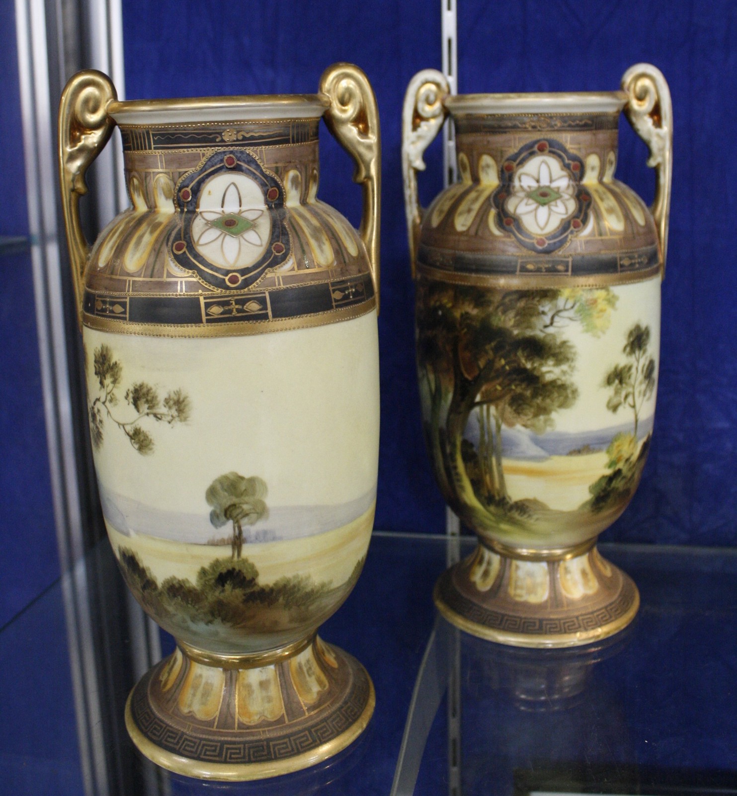 Pair Noritake two-handled vases, painted with lake scene, 26.5cm high