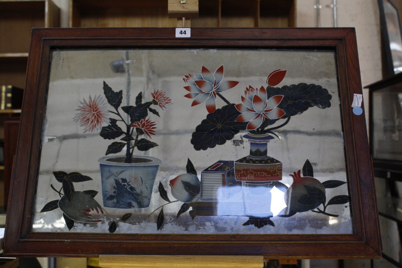 A 20th Century Chinese reverse painted mirror, 39cm x 59.5cm
