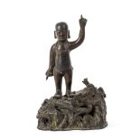 A bronze figure of the infant Buddha, Ming dynasty,   the divine child standing with both index