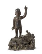 A bronze figure of the infant Buddha, Ming dynasty,   the divine child standing with both index