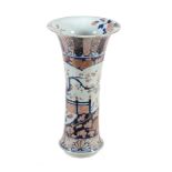 An Arita Beaker Vase   of typical form with trumpet neck, decorated in underglaze blue, rouge-de-