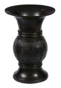 An archaistic bronze  zun   vessel,   the ovid body with four flanges  on flared foot and with