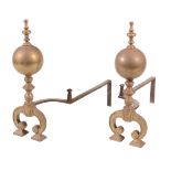 A pair of brass and wrought iron mounted andirons, early 18th century  A pair of brass and wrought