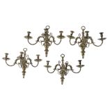 A set of four gilt brass three light wall appliques in late 17th/ early 18th...  A set of four