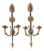 A pair of patinated and gilt metal twin light wall appliques in Empire style  A pair of patinated