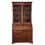 A George III bureau bookcase , circa 1790  A George III bureau bookcase , circa 1790, the dentil