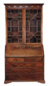 A George III bureau bookcase , circa 1790  A George III bureau bookcase , circa 1790, the dentil