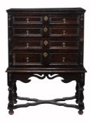A Charles II chest on stand, circa 1680, the rectangular plank top with...  A Charles II chest on