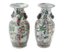A pair of Cantonese vases, 19th century, painted with panels of figures on...  A pair of Cantonese