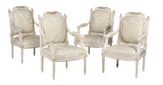 A set of four cream painted and parcel gilt armchairs in Louis XVI style  A set of four cream