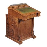 A Victorian walnut and inlaid davenport , circa 1850  A Victorian walnut and inlaid davenport  ,