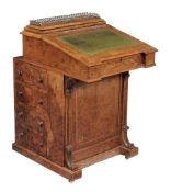 A Victorian walnut and inlaid davenport , circa 1850  A Victorian walnut and inlaid davenport  ,