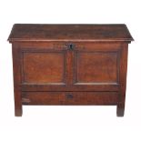 An oak mule chest , mid 17th century and later, dated 1653 and initialled KS  An oak mule chest  ,