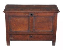 An oak mule chest , mid 17th century and later, dated 1653 and initialled KS  An oak mule chest  ,