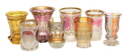 Eight various Bohemian colour-flashed and engraved beakers  Eight various Bohemian colour-flashed