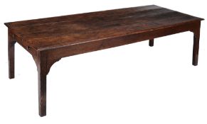 An oak refectory table , 19th century, the plank top with moulded edge above...  An oak refectory