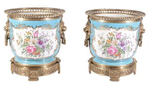 A pair of modern Sevres-style porcelain gilt-metal-mounted jardinieres in...  A pair of modern