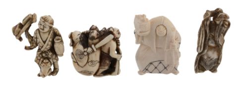 A Walrus Ivory Netsuke of an oni carrying a large sack in which is hidden Shoki  A Walrus Ivory