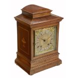 An Edwardian inlaid mahogany quarter striking mantel clock  An Edwardian inlaid mahogany quarter