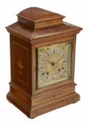 An Edwardian inlaid mahogany quarter striking mantel clock  An Edwardian inlaid mahogany quarter