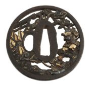An Iron Soten School Tsuba of circular form pierced and carved within the...  An Iron Soten School