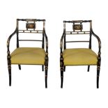 A pair of Regency black painted and parcel gilt elbow chairs , circa 1815  A pair of Regency black