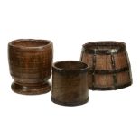 A turned ash mortar, 18th century, with lightly ribbed exterior and waisted...  A turned ash mortar,