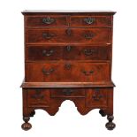 A walnut chest on stand , mid 18th century and later  A walnut chest on stand  , mid 18th century
