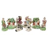 A pair of Staffordshire pearlware figures of a musician and companion with...  A pair of