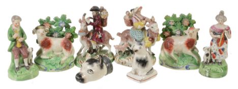 A pair of Staffordshire pearlware figures of a musician and companion with...  A pair of