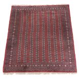 A Bokhara carpet, approximately 293 x 225, together with a Bokhara runner  A Bokhara carpet,