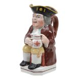 A Staffordshire pottery Toby jug, circa 1825  A Staffordshire pottery Toby jug,   circa 1825,