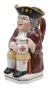 A Staffordshire pottery Toby jug, circa 1825  A Staffordshire pottery Toby jug,   circa 1825,