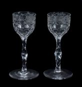 A pair of engraved facet-stemmed wine glasses , late 18th century  A pair of engraved facet-