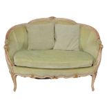 A French Louis XVI style sofa , with carved and curved top rail leading to...  A French Louis XVI