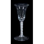 A colour-twist wine glass, circa 1765, the bell bowl supported on stem with...  A colour-twist