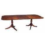 A mahogany twin pedestal dining table , early 19th century and later  A mahogany twin pedestal