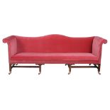 A pair of mahogany and upholstered sofas in George III style