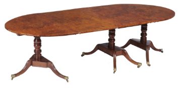 A George IV burr yew triple pillar dining table, circa 1825