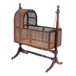 A Regency mahogany cradle on stand, circa 1800