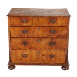 A George II walnut chest of drawers, circa 1735