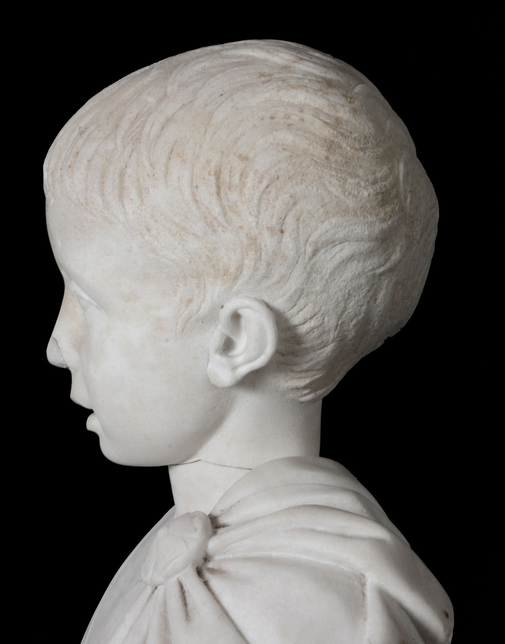 An Imperial Roman sculpted marble head of a young boy, circa 1st Century A.D - Image 4 of 6
