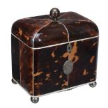 A late George III tortoiseshell veneered and ivory banded tea caddy