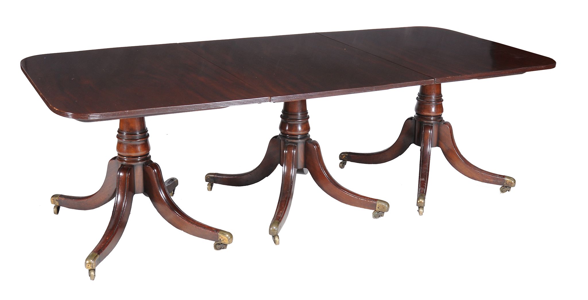 A George III mahogany triple pillar dining table , circa 1800