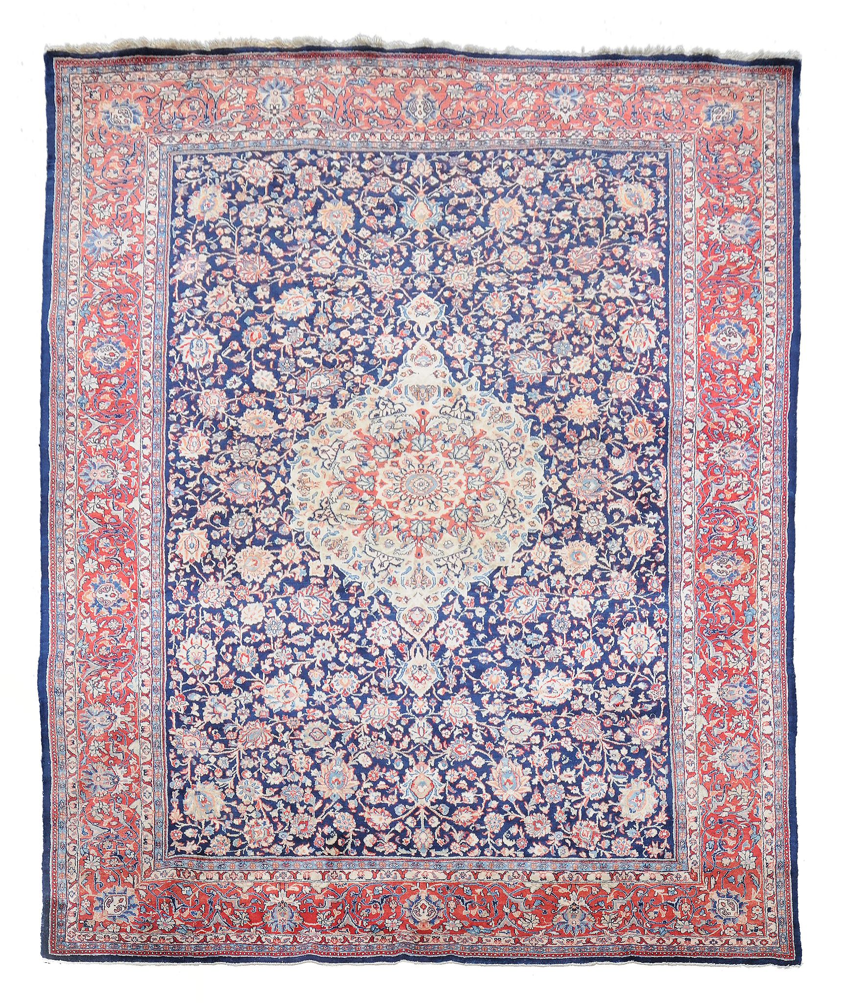 A Kirman carpet, the central medallion within a field of meandering foliage...